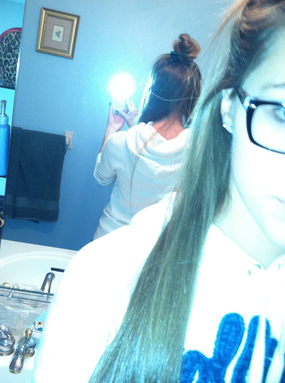 Section off the bottom layer of your hair, clipping the rest up.