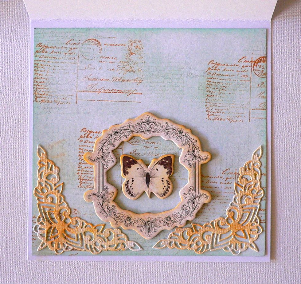 Secure adhesive chipboard frame and butterfly inside card.