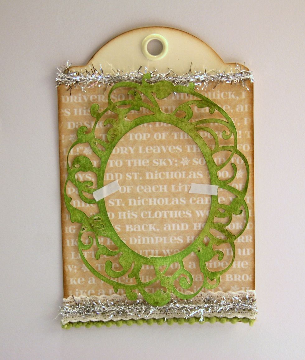 Secure die cut frame to center of tag.