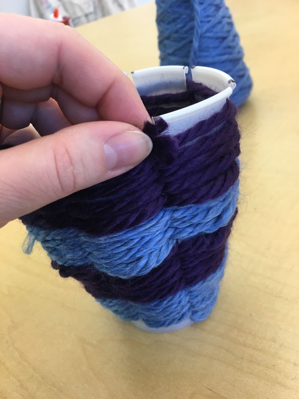 Secure the end if the yarn inside your cup so it does not unravel. You could knot it if it is too loose.
