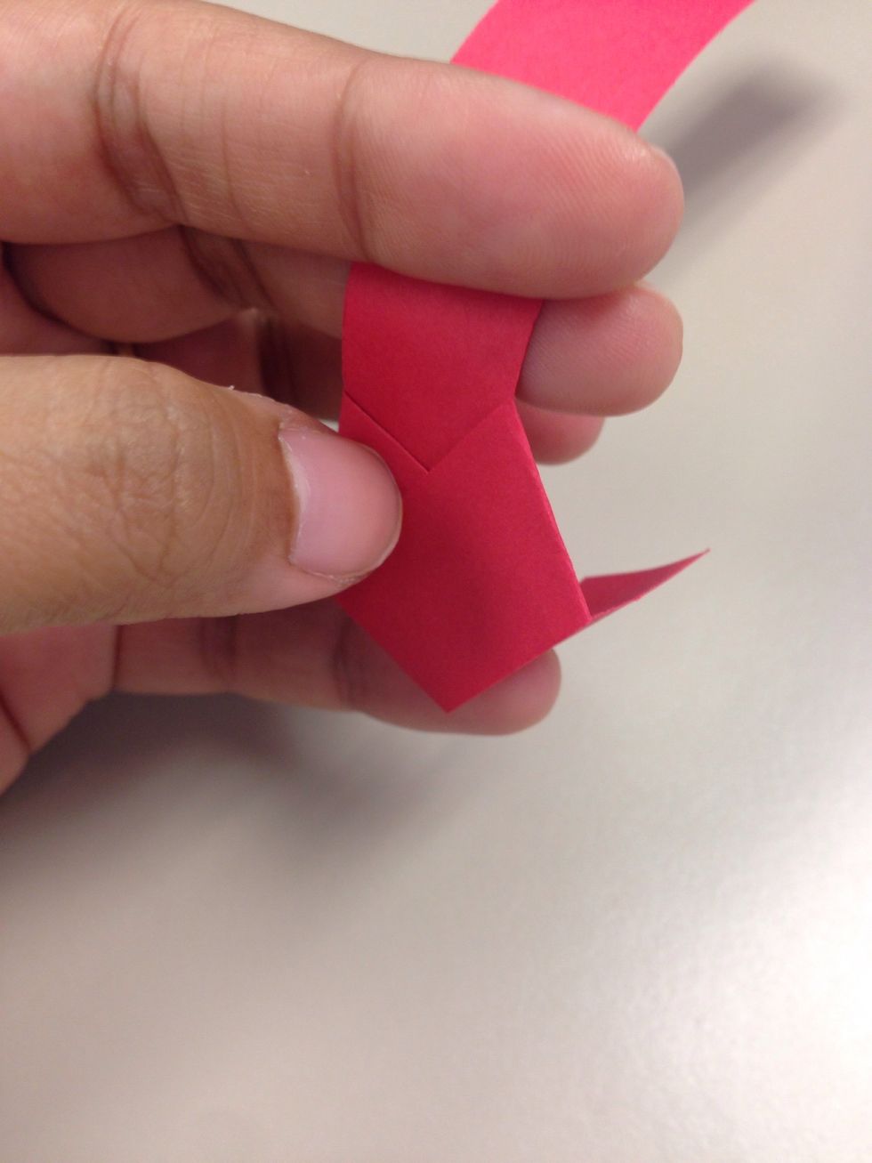 Secure the smaller end by inserting into a fold like shown