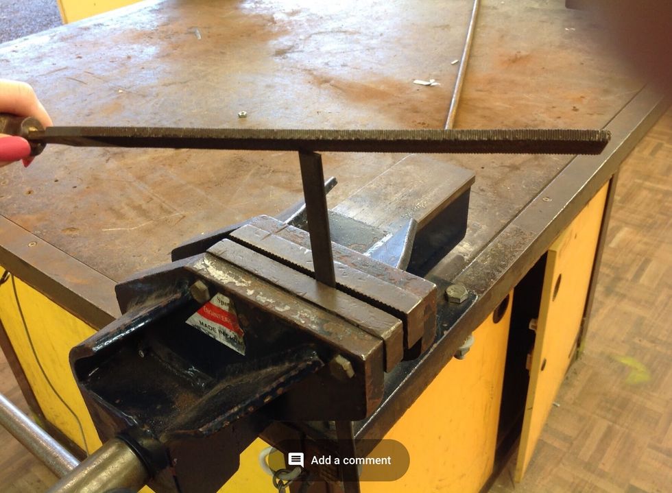 Secure your flat bar in the Vice and now use the file to file the ends and edges of your flat bar till smooth