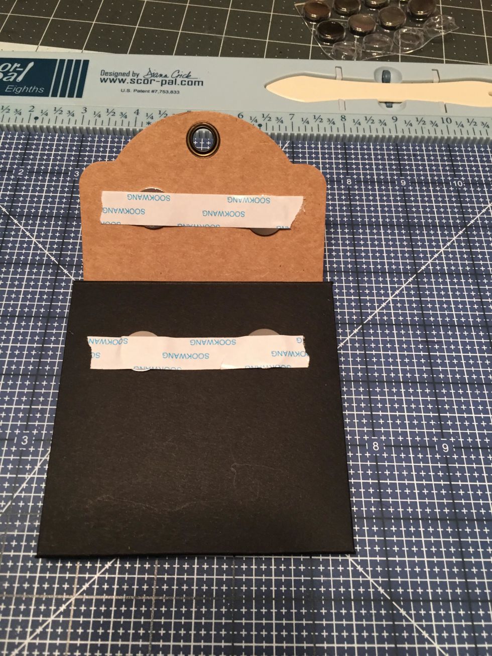 Secure your magnets in place for now with a strip of scor-tape (leave the backing on) or with scotch tape.