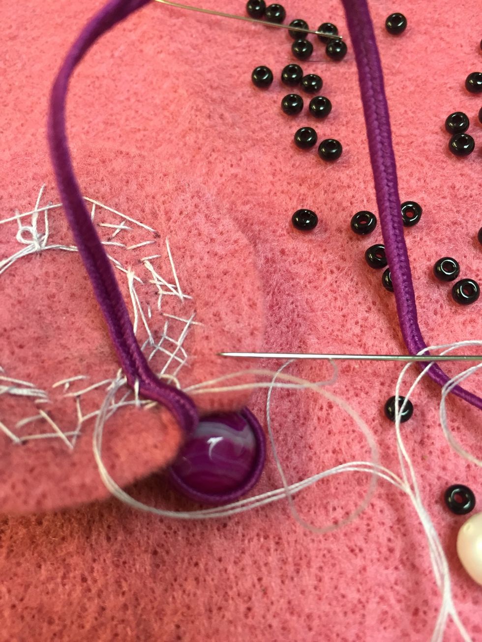 Secure your threads in the back and glue the tip of your cording once you are ready to cut