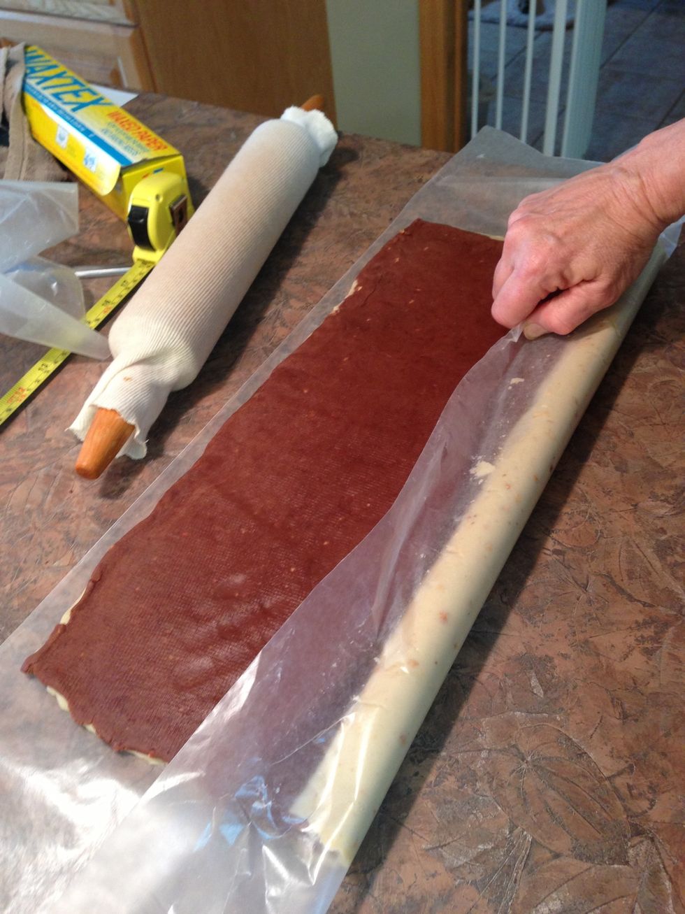 See how helpful again the wax paper can be for helping to LIFT & roll? Do not roll wax paper into the dough however. Remember... Roll dough TIGHTLY!