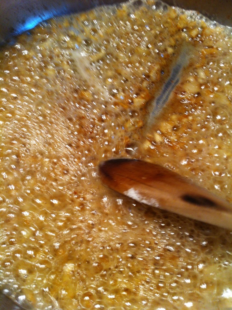 See how the sauce is starting to thicken? Scrape the pan, it takes a second to fill in. It's ready for the milk.