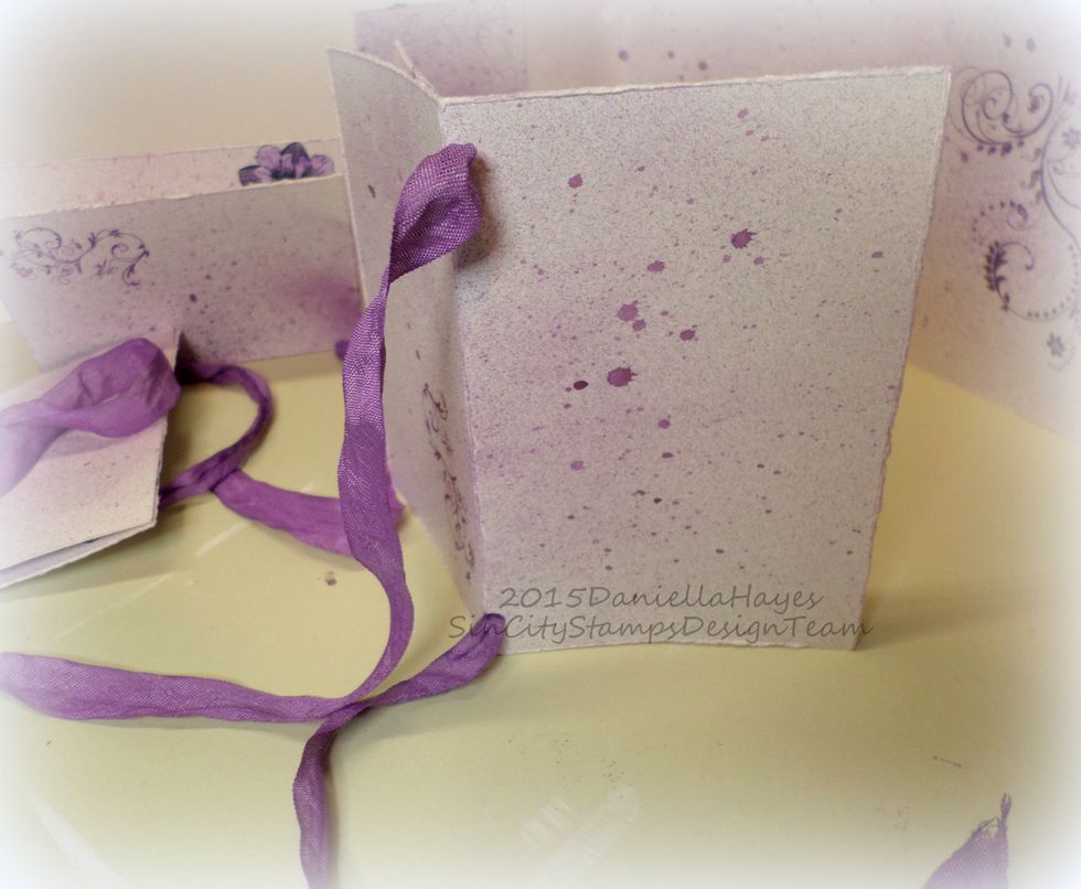 See how the seambinding comes out of the back of the signature? Put the seambinding in all 3 signatures. You are doing a great job!!