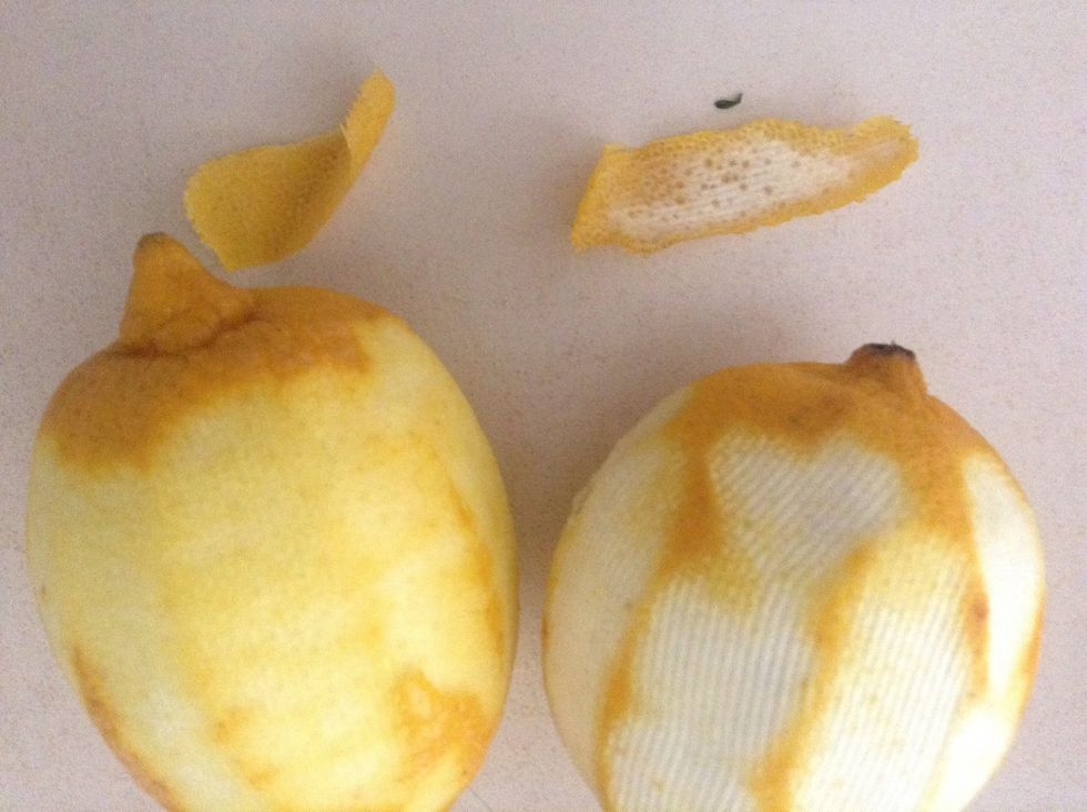 See the difference in the peels. The white is bitter, whereas the yellow outermost layer has quite a pleasant taste and has the lovely lemony oil that will give the flavour, the left peel is ideal.
