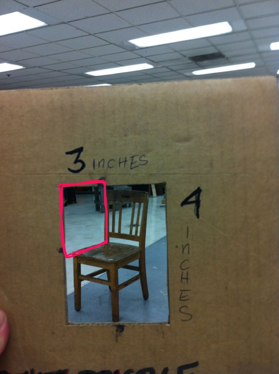 See the negative spaces created between the chair and the view finder first.