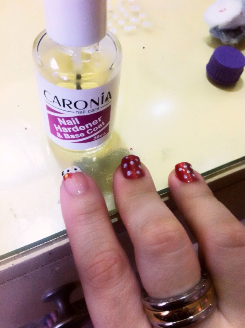 See the photo. About the red nails also use the ear buds (sharp edge) dip in white and make dots on the top of the red polished fingers (see photo)
