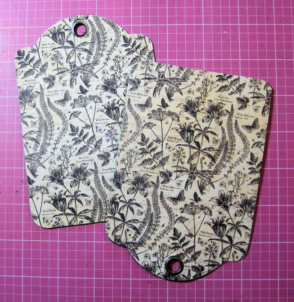 Select a 12x12 pattern from Patterns & Solids pad. Trace around the tags onto the paper. Trace inside the grommet for placement. Punch grommet hole with 1/2" paper punch. Trim paper & glue onto tag.