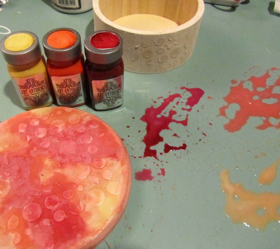 Select a couple of Art Anthology Sorbets. I picked Red Velvet, Sunshine and Coral. Put a bit of each on you craft mat and mix in some water. Paint the lid, let the colors mix and blend.
