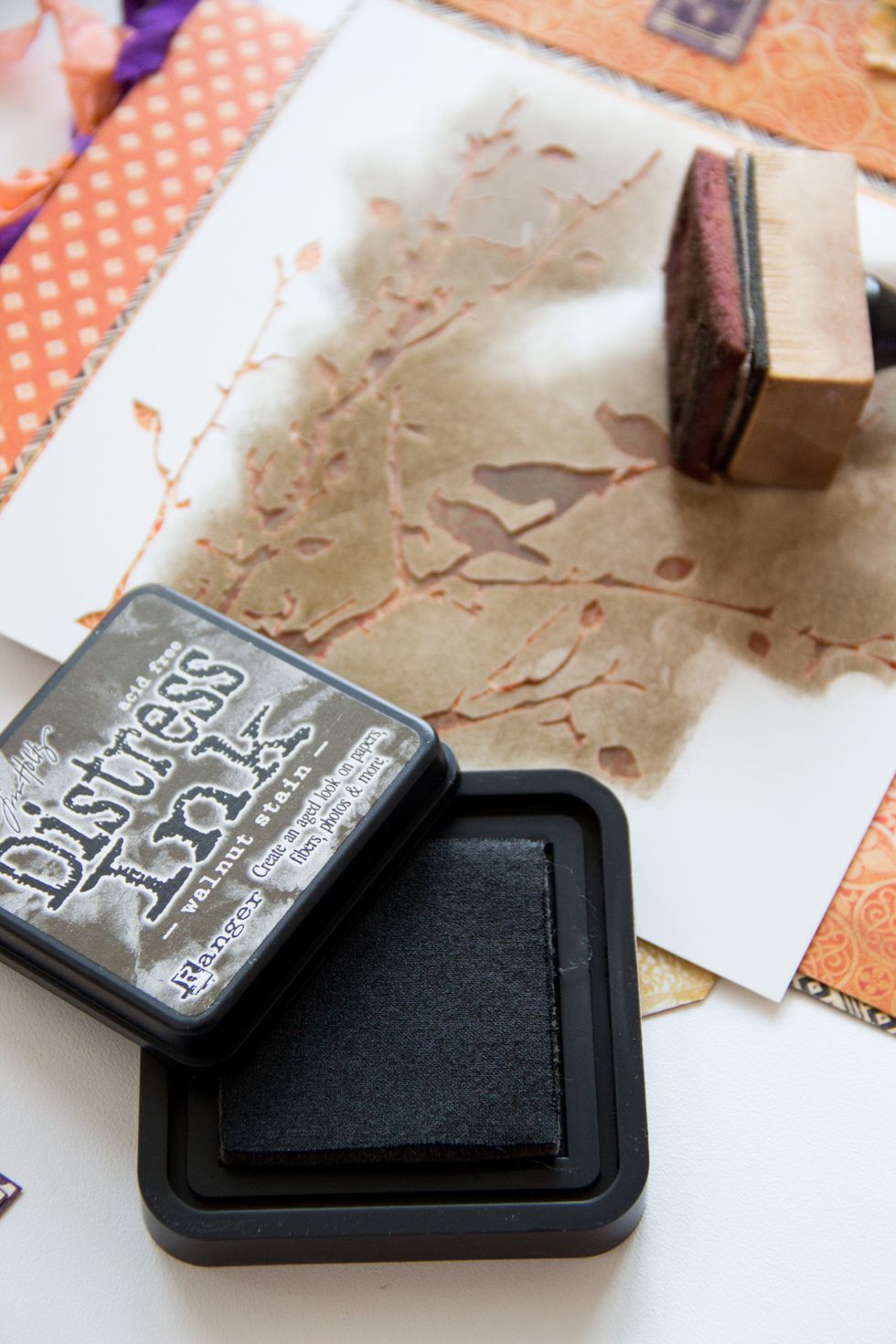 Select a mask and make an image use Distress Ink Walnut Stain.