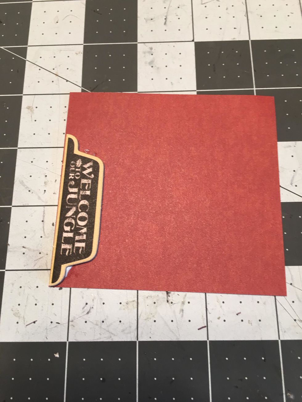 Select a tab from the Graphic 45 Chipboard sets. Glue to the back side of patterned paper.