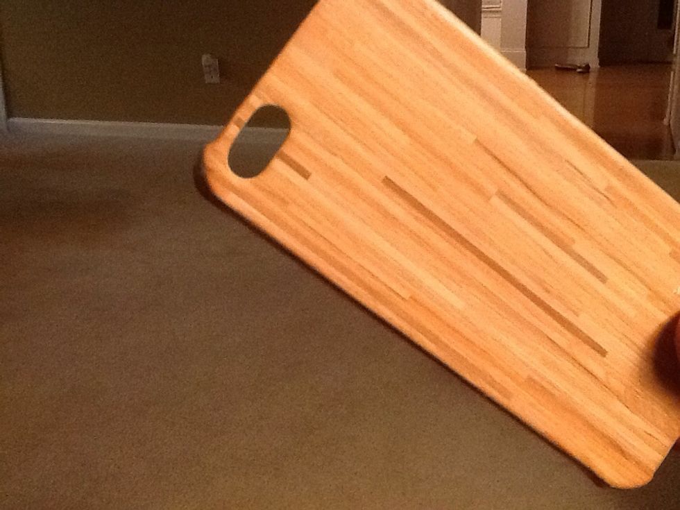 Select an inexpensive phone cover or shell. This one looks like laminated wood.