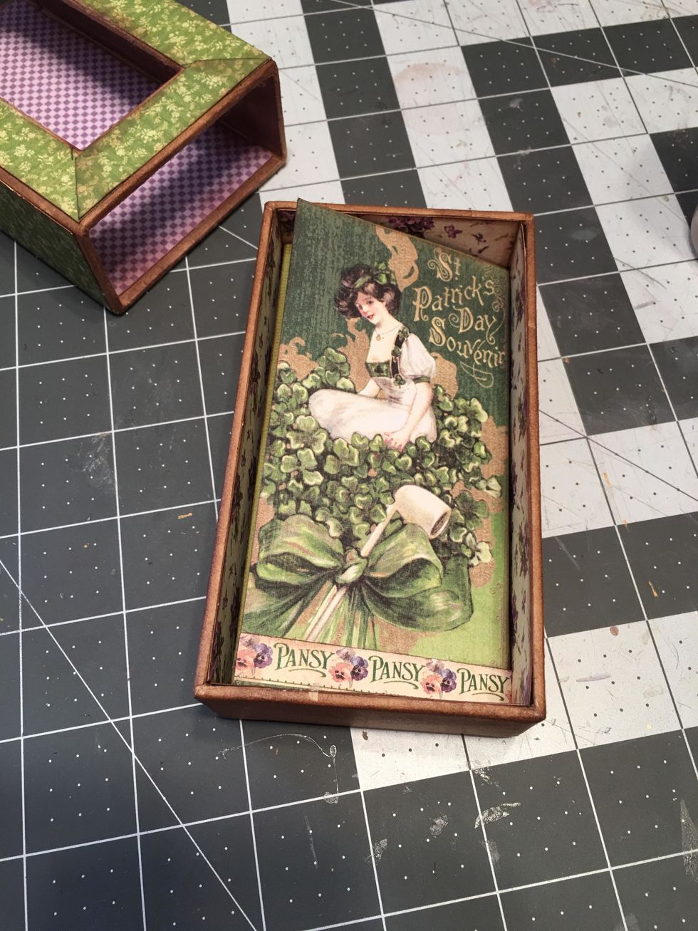 Select and cut pattern papers to fit each section of the fold out. You may need to piece papers to cover some of the section. Ink all edges and attach onto the fold out sections with glue.