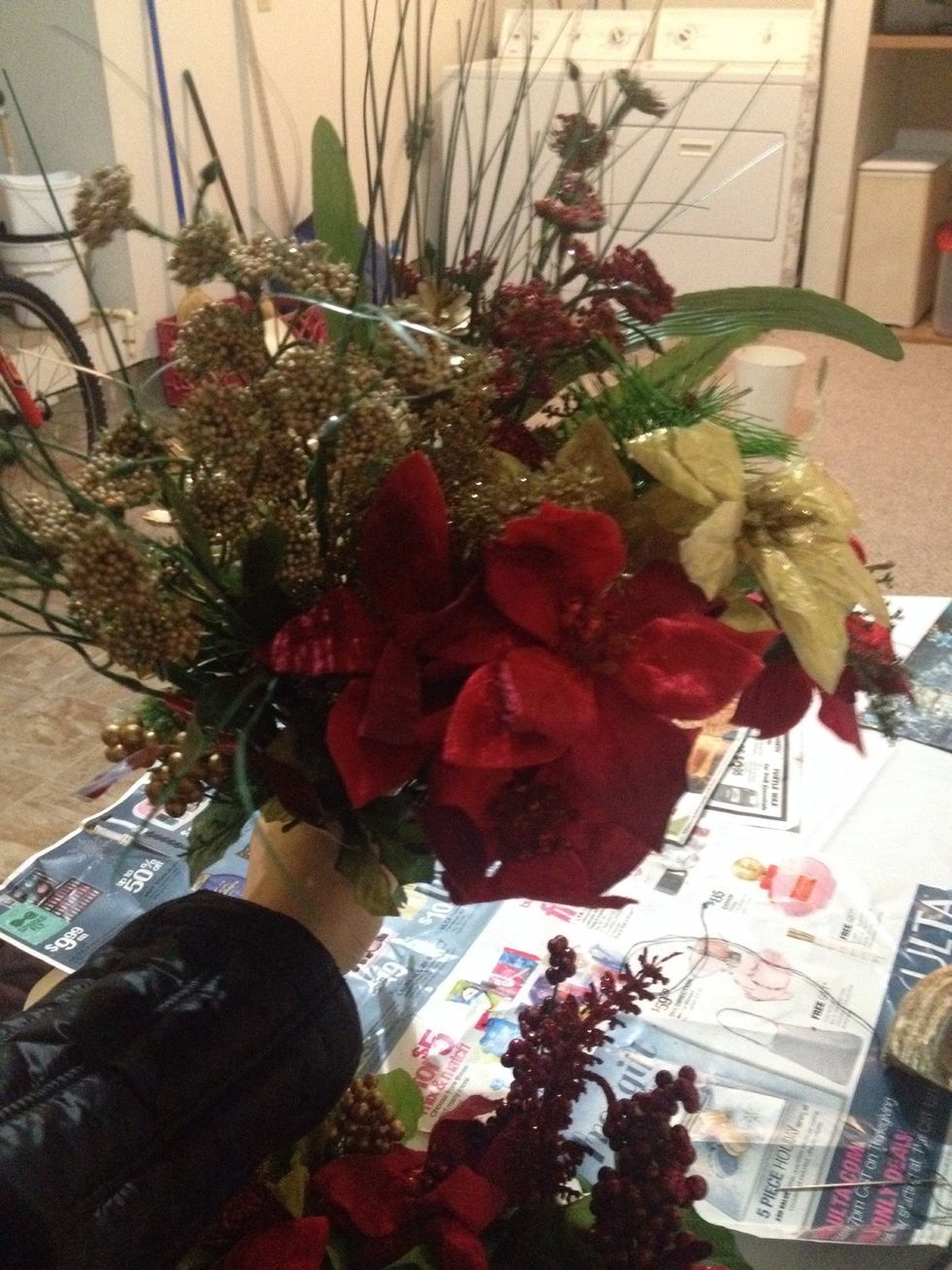 Select around 8 bunches of fake flowers at your local dollar store. Pick just three or four types to create a cohesive look later.