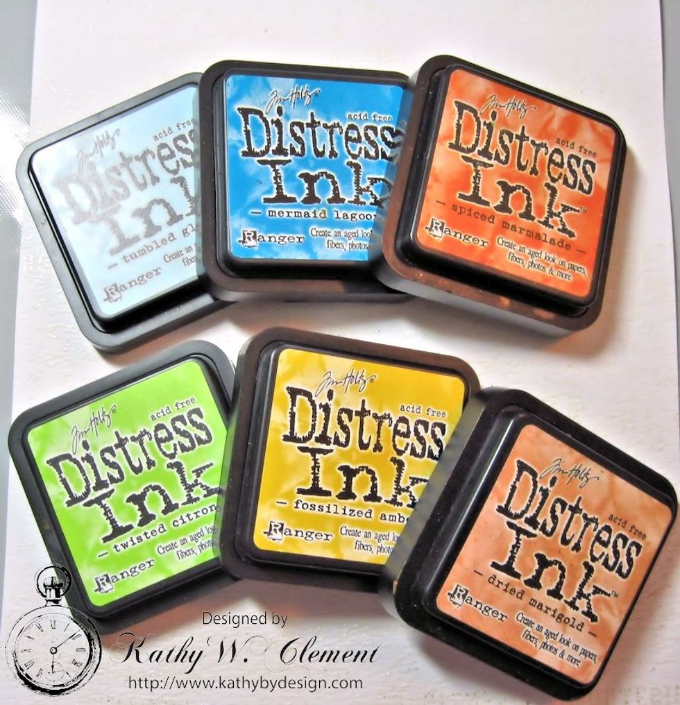 Select Distress Inks in your preferred color palette. I've chosen to work with Tumbled Glass, Mermaid Lagoon, Spiced Marmalade, Twisted Citron, Fossilized Amber and Dried Marigold.