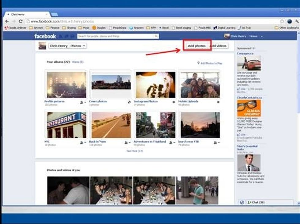 Select the 'Add Photos' button in the top right corner of the screen