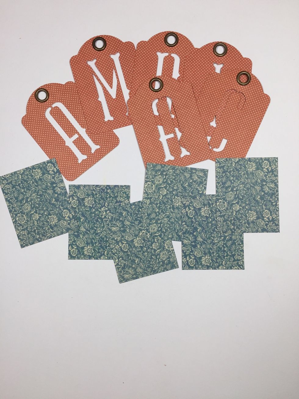 Select the alphabet banner tags to spell your desired word. Cut the same numbers of blue pattern paper pieces measuring 2 1/4" x 2 3/4".