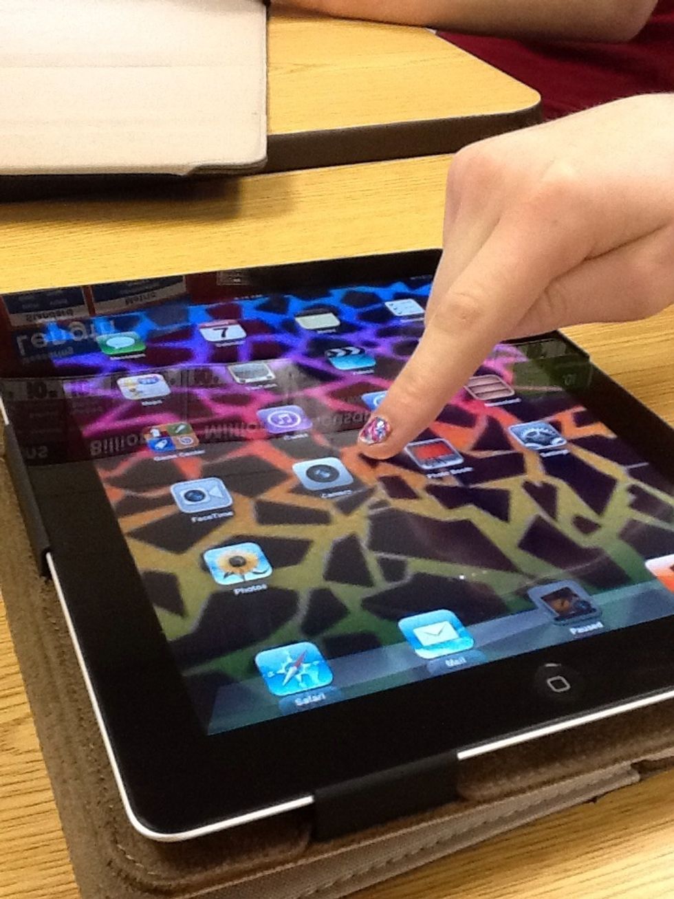 Select the app with a camera lens icon