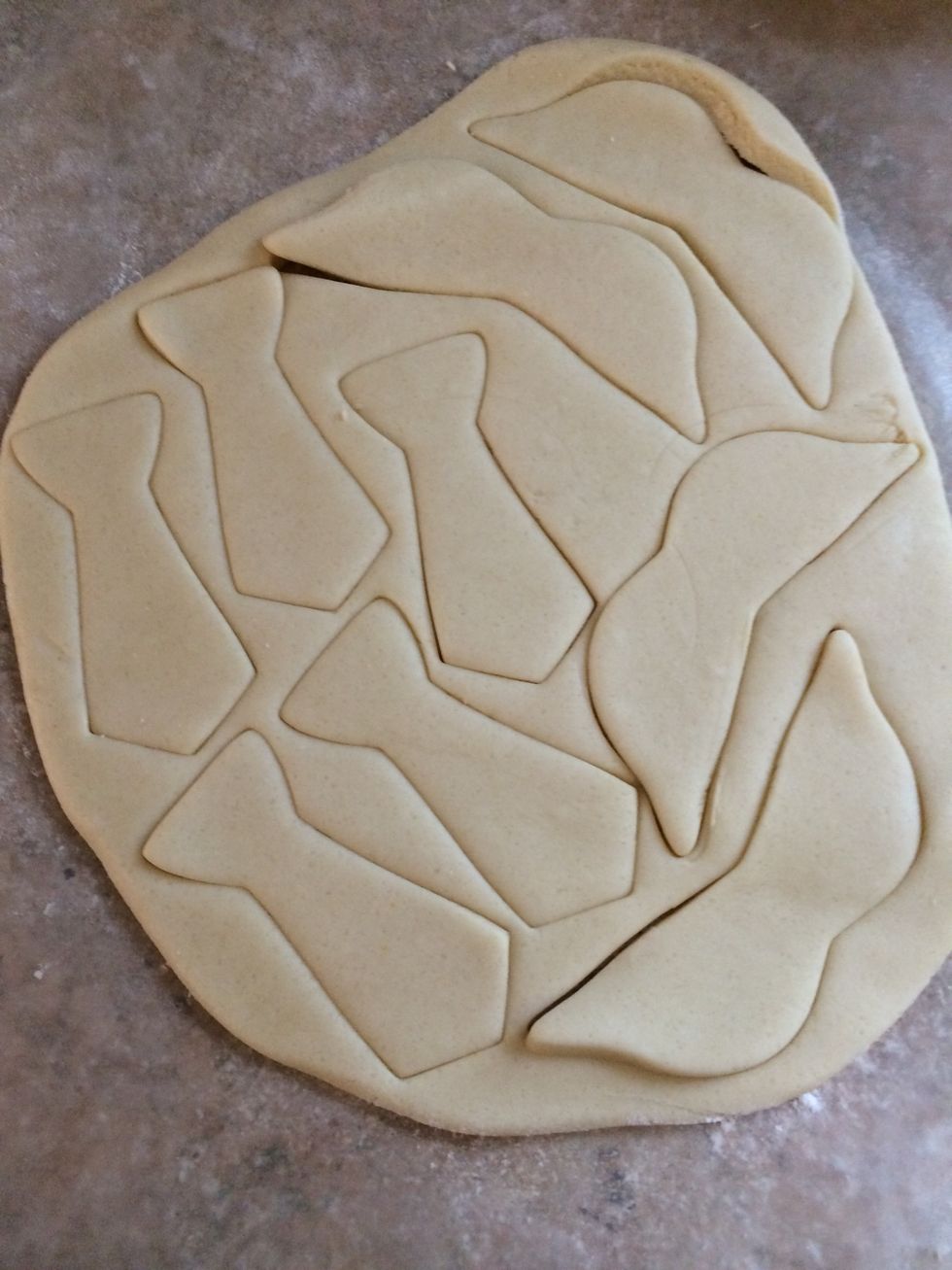 Select the cookie cutters you want to use - cut out the shapes and carefully lift and transfer to cookie sheet lined with parchment paper