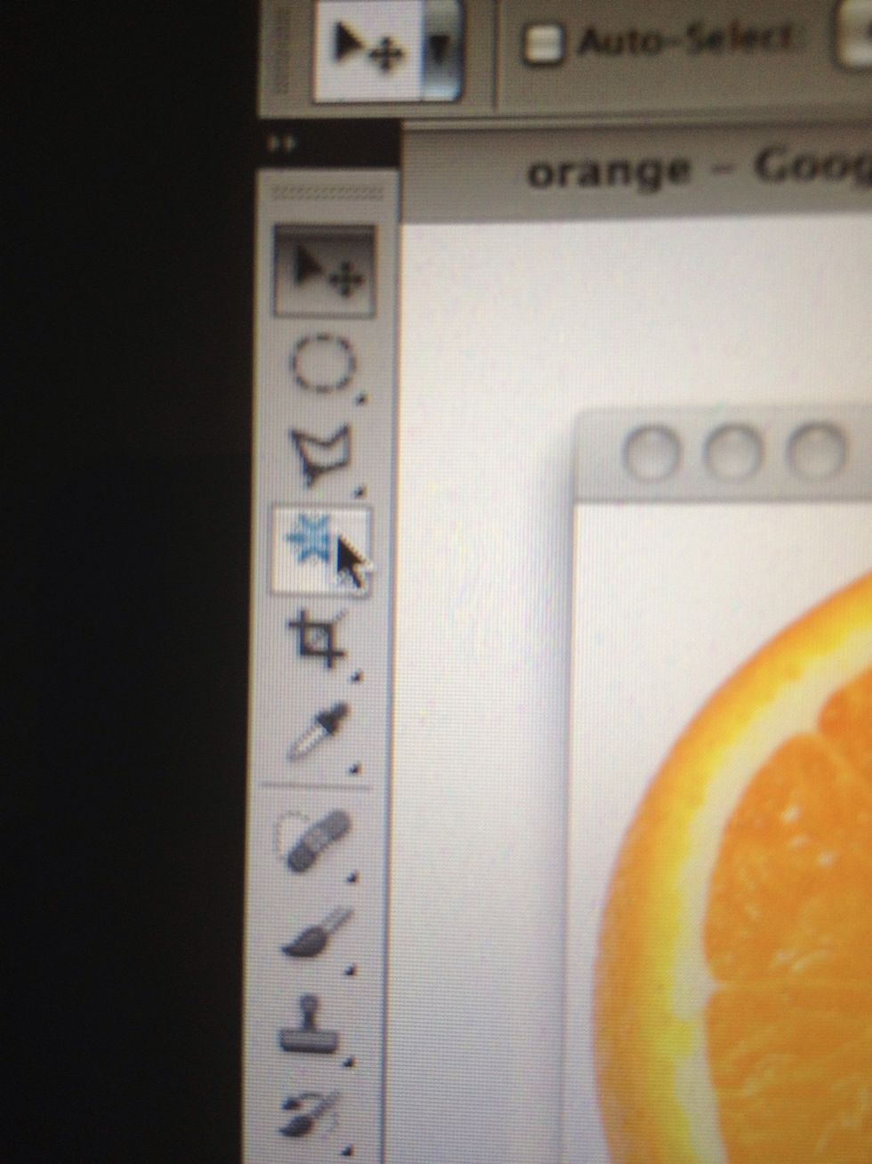 Select the magic wand tool and click the white part around your apple. It will select all areas of the same color and we can then delete them.
