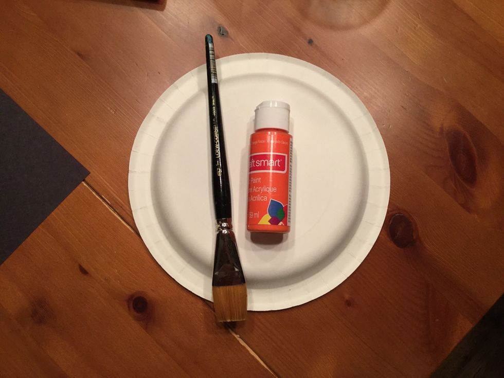 Select the orange paint and paint brush best suited for the paper plate pumpkin.\n