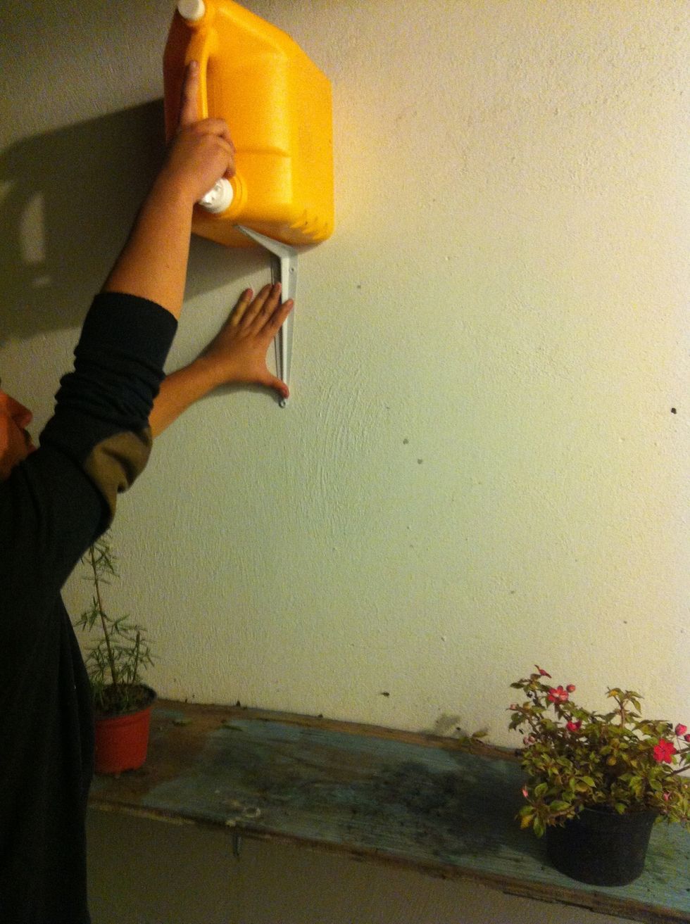 Select the right spot to place your container. Make sure it is high enough for gravity to work and centered.