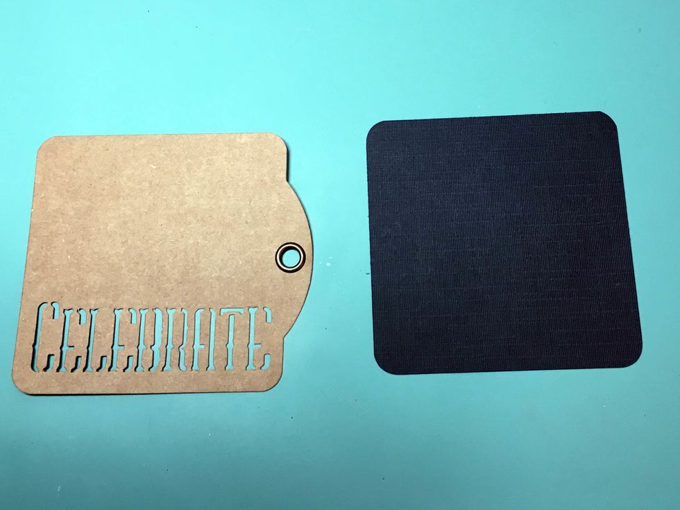 Select two Graphic 45 Staples square tags; I've used Celebrate and Cheers. Cut a 4.5" square of black cardstock and round the corners to match the tag.