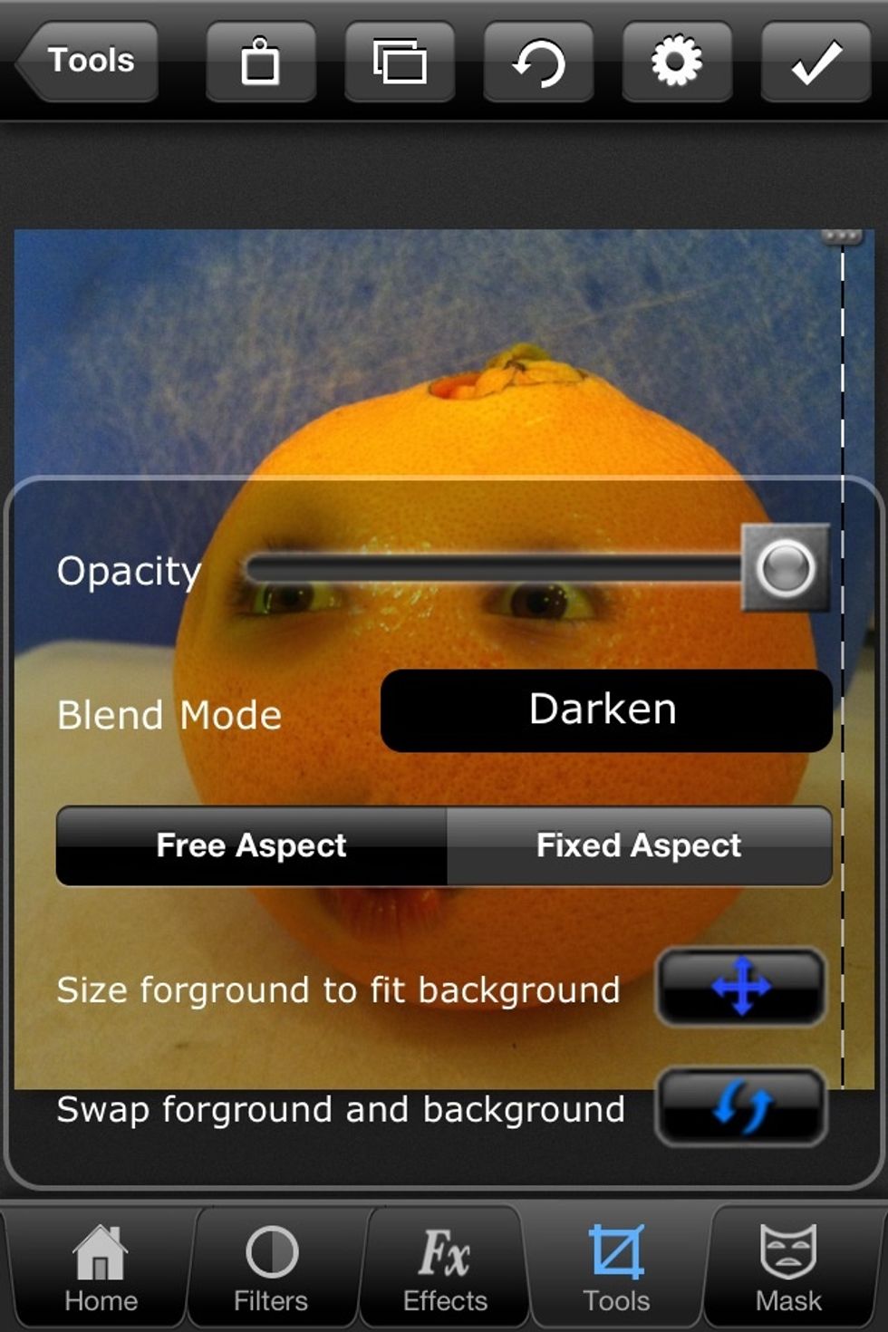 Select your orange photo and swap the foreground and background as needed. Size your face elements to what you like. Keep opacity up, but choose a blend mode that you like. I'm using "darken."