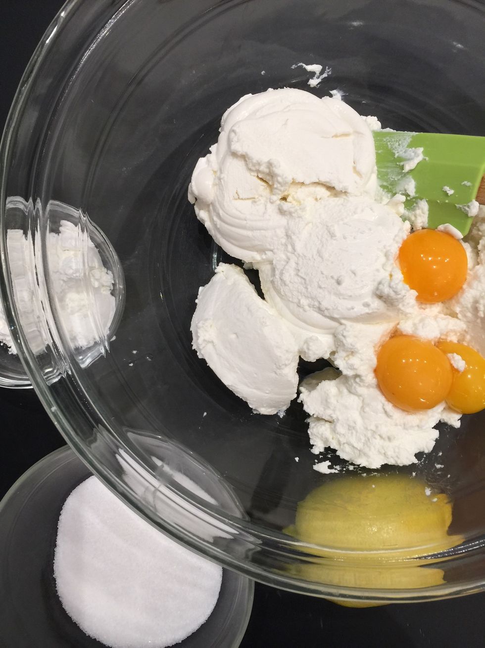 Separate eggs.  Add yolk over cheese