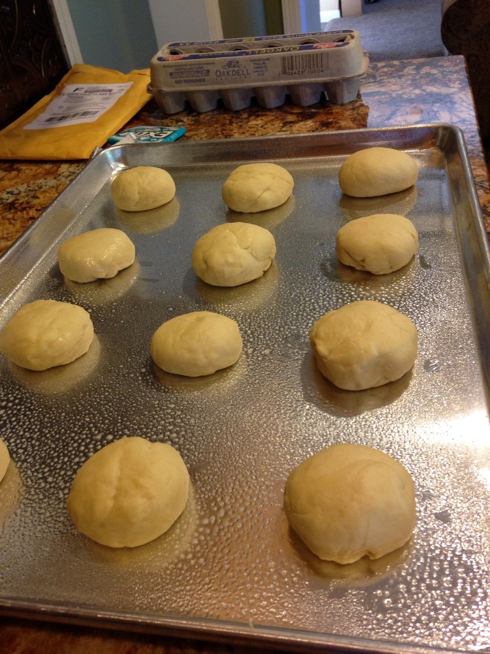 Separate it into 12 equal amounts and roll dough into balls. Place on a greased cookie sheet.