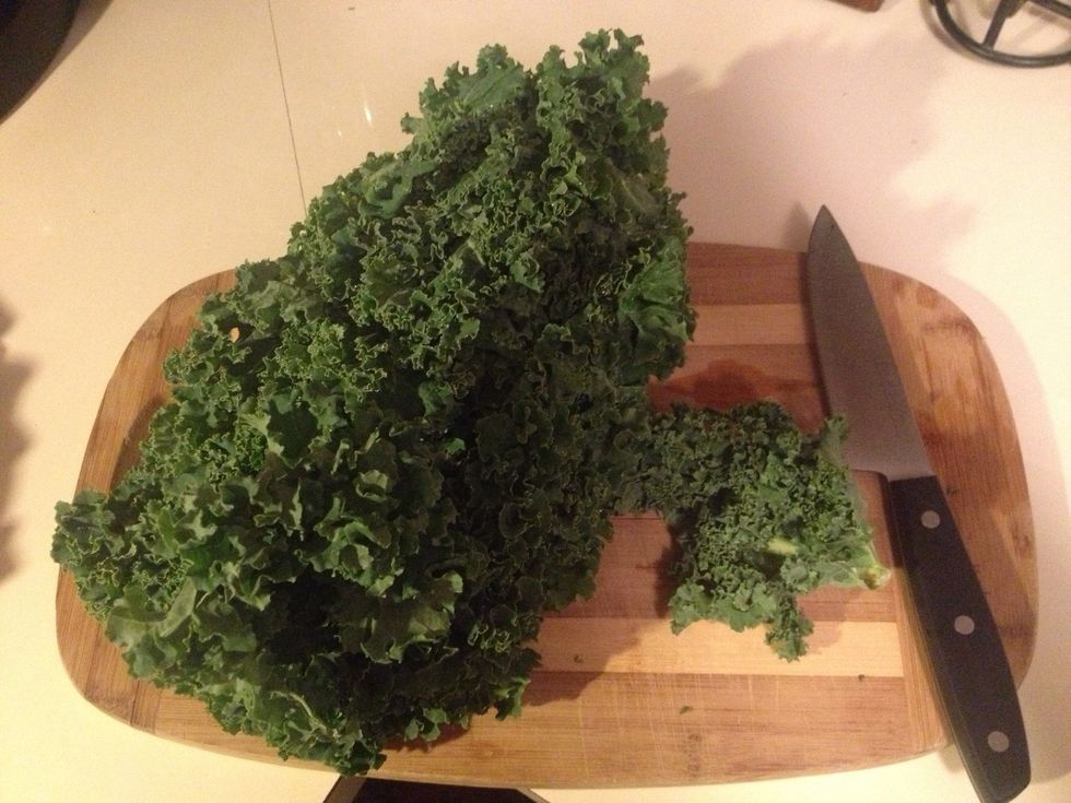 Separate leaves from the bunch of kale.