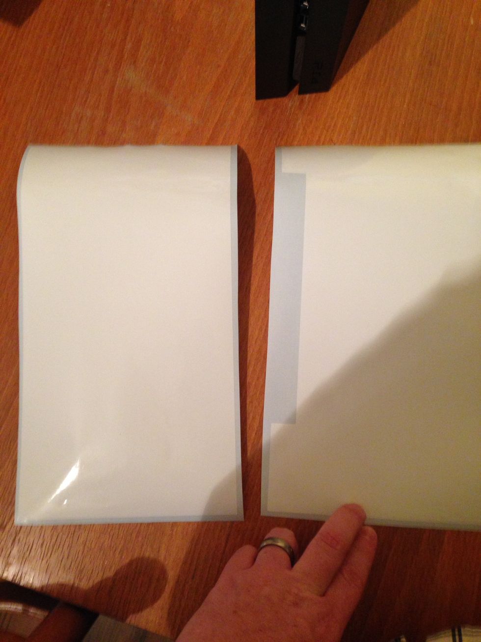 Separate the 2 skins. The skin with the slot is for the bottom of your console.