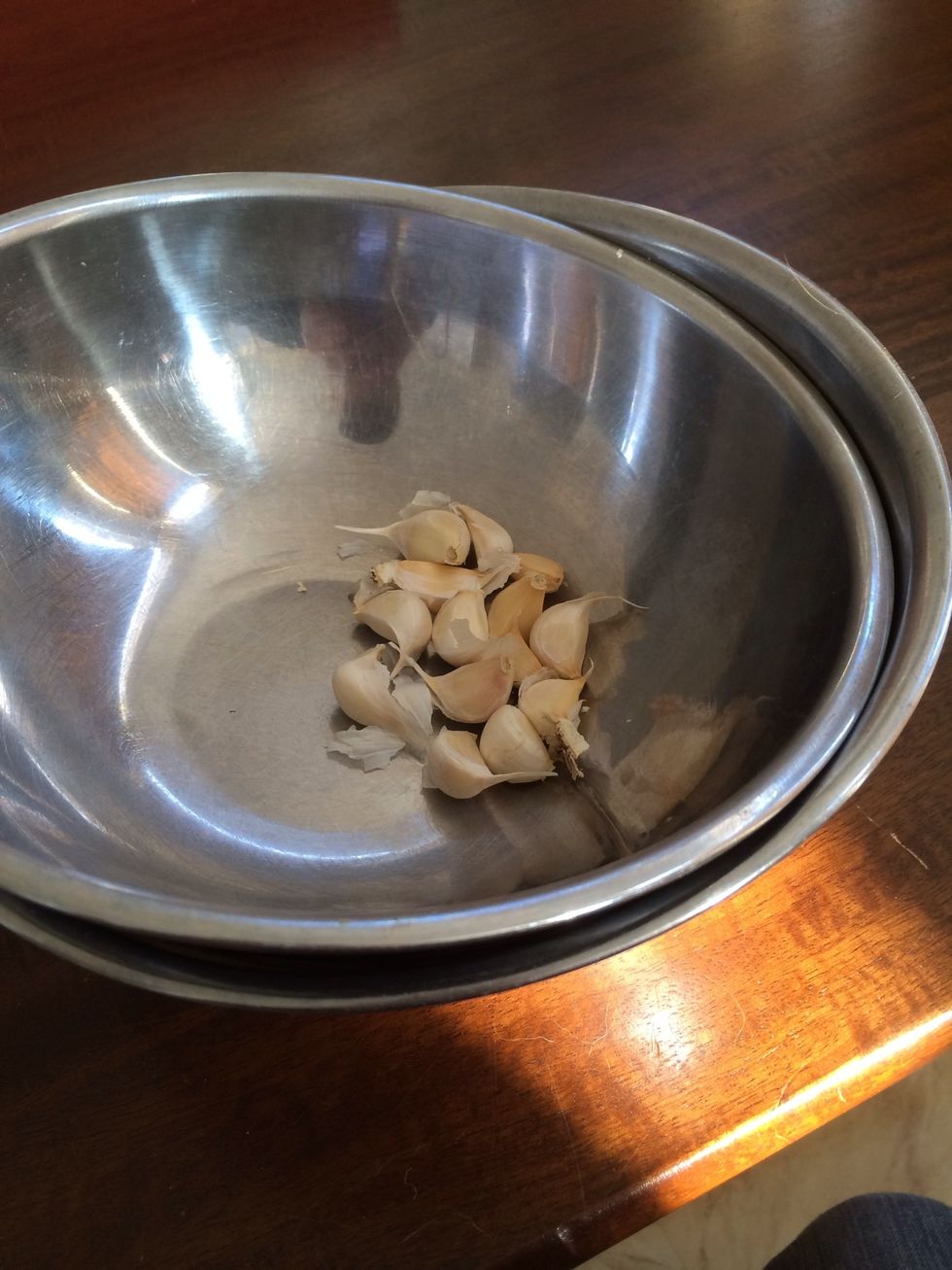 Separate the cloves from the bulb leaving the papery skin on.