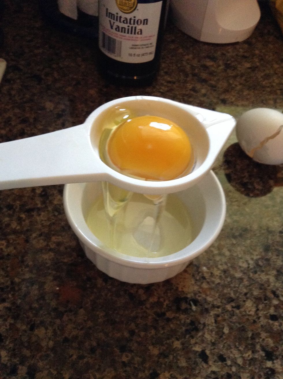 separate the egg yolk from the egg white