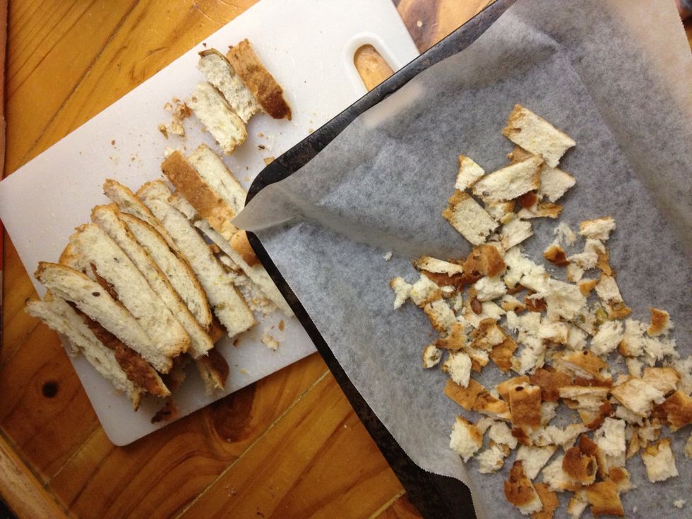 Separate the full crusts from the broken ones, put them in a freezer bag (you can bake them at a later date and use them as dipping sticks). Tear the remaining ones apart and bake in oven for 20 mins.