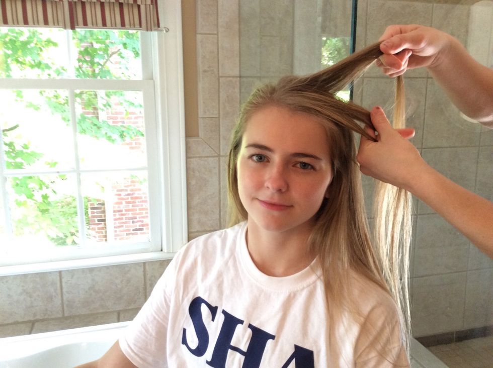 Separate the piece of hair into three equal pieces.