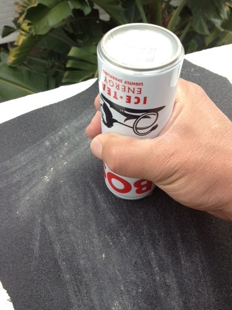 Separate the top from the body of the can by rubbing the top lip against sand paper. Sanding tip: Use long strokes and rotate the can around as you go. This will allow the full seal to be broken.