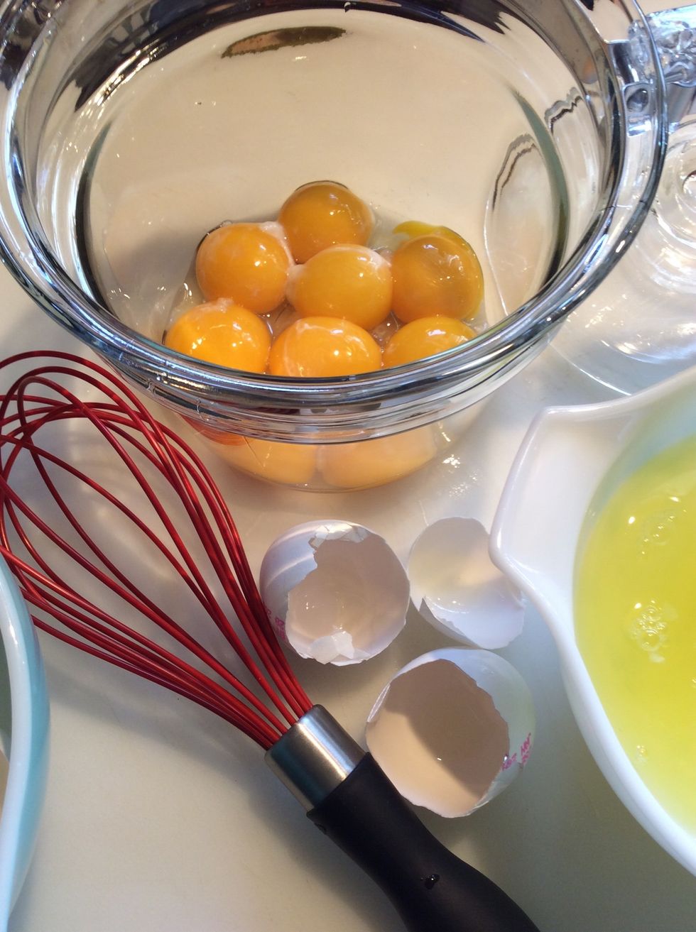 Separate the whites from the yolks. Place the yolks in the double boiler.