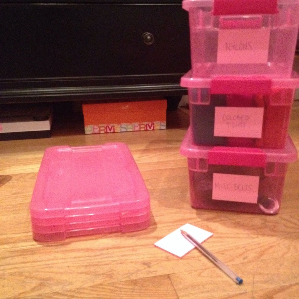 Separate what you want in each bin. On a label clearly write what is in each container. Apply label to the side that will be shown when you put them away.