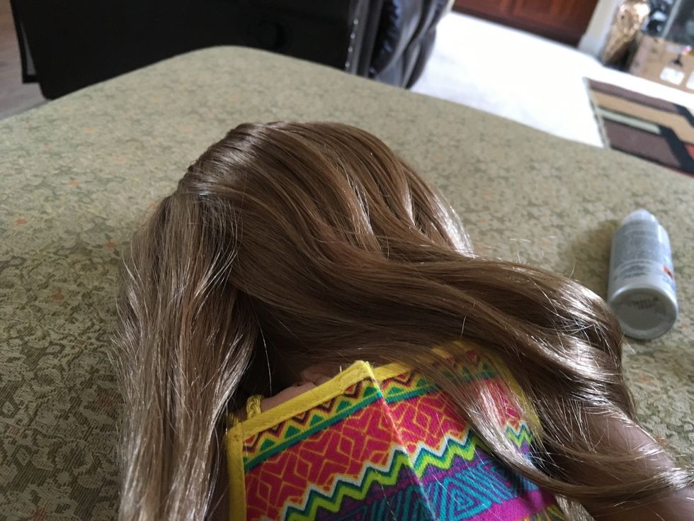 Separate your doll\u2019s hair into three sections