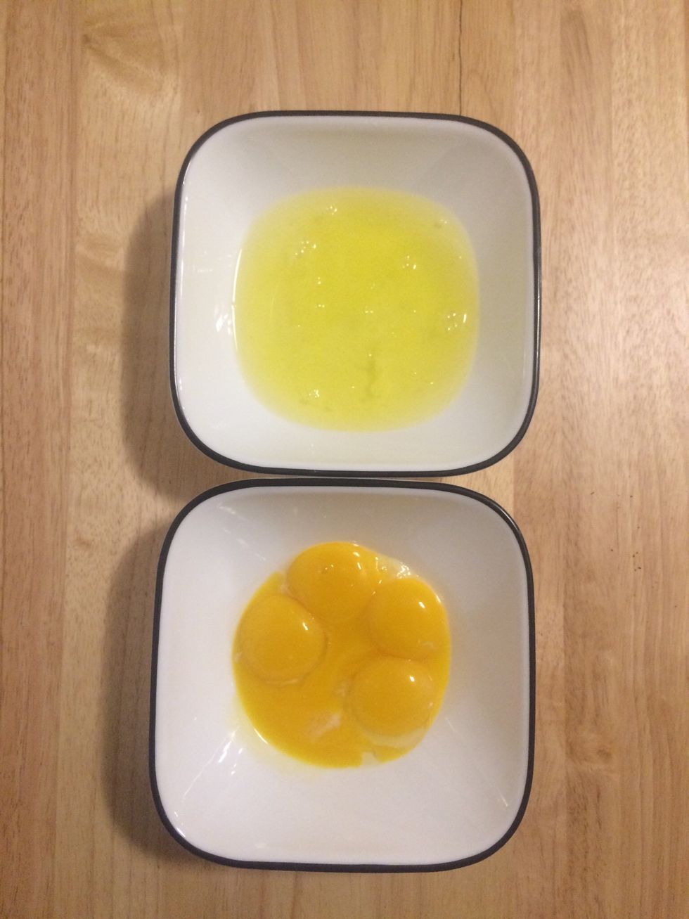 Separate your eggs yolks into one bowl and the egg whites in another.