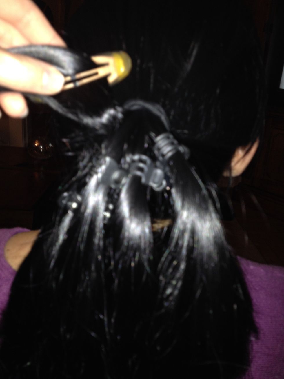 Separate your hair into around 7 or 8 sections using smaller clips