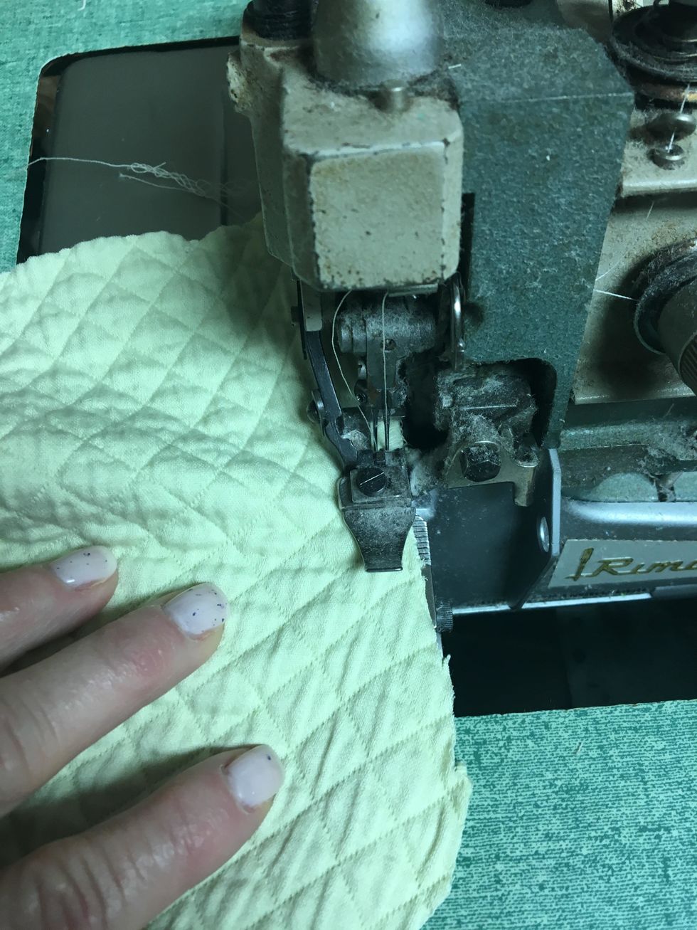 Serge or ZigZag both layers together along the edges all the way around of the slips and all the tabs.