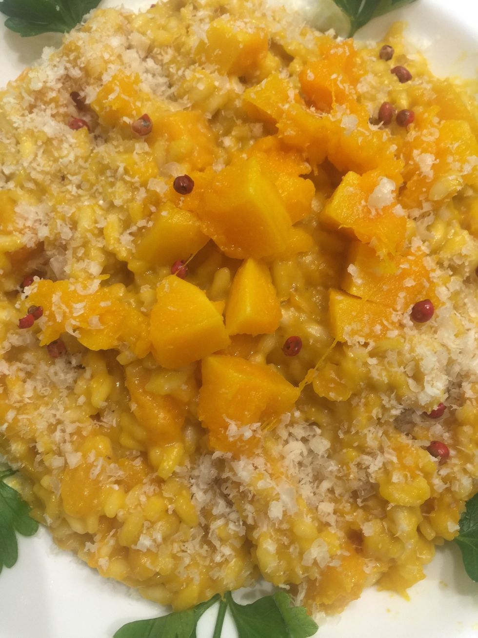 Serve. Add the rest of the grated Parmesan and few pieces of pumpkin. And the red pepper corns