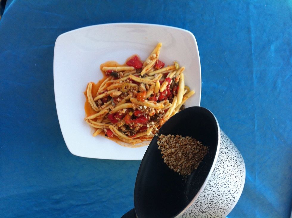 Serve on large plates and  spread some crushed almond on top with a little bit of chopped parsley.
