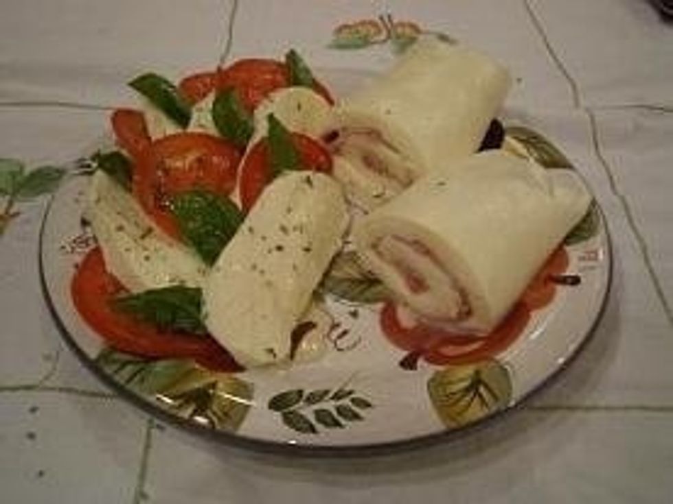 Serve the freshly stretched Mozzarella by itself or however desired. Try it with fresh tomatoes, basil, and oregano, complimented by drizzling olive oil lightly over top; an Italian Specialty.
