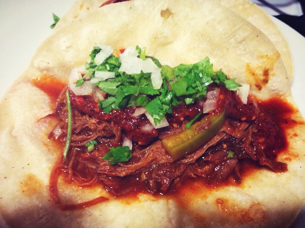Serve the meat with the warm tortilla. I spread my flaming salsa in the tortilla, add the meat, and top it off with cilantro and chopped onion.